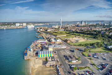 Aerial of the entrance to Portsmouth Harbour the main base for the Royal Navy, as a ferry departs with the Spinnaker Tower in view and Gosport.