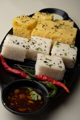 Indian popular Gujrati breakfast dish White Dhokla, Khatta , Rice and Urad Dal Khaman. Also known as Instant Rava Dhokla AND yellow dhokla or besan gram flour. served with ketchup 