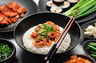 Korean food, rice, kimchi, kimbap, pickled radish on black background