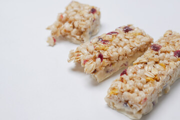 Almond , Raisin and oat protein bars on table 