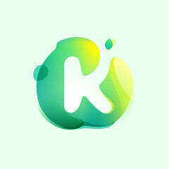 K letter logo in eco gradient splash blot with green leaf. Negative space environment friendly icon. Illusion effect emblem.