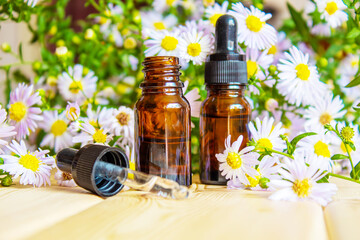 flower oil in glass bottles.homeopathy.selective focus