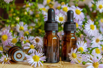 Obraz na płótnie Canvas flower oil in glass bottles.homeopathy.selective focus