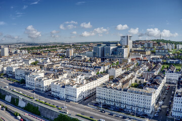 Aerial view from Marine Parade with beautiful Victorian buildings along the seafront and Brighton Hospital in the background.