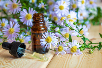 flower oil in glass bottles.homeopathy.selective focus