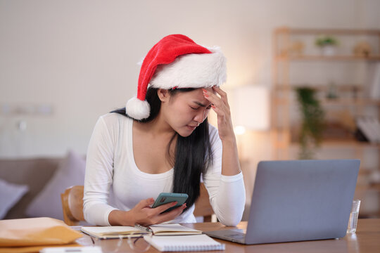 Young Asian woman with emotional problems Stressed and sick, weak and restless on Christmas.