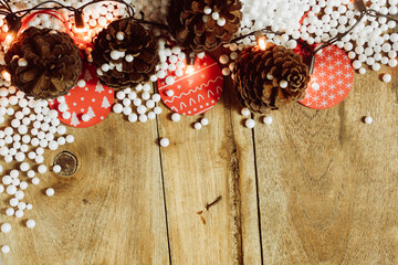 Christmas light and decorations on wooden table for background