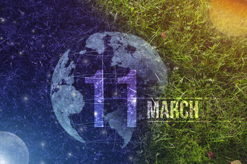 March 11st . Day 11 of month, Calendar date. Day to night background concept. Scene with globe the green grass with sun, stars, moon and calendar date. Spring month, day of the year concept.