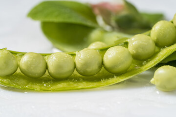 Fresh snow peas on monochrome background