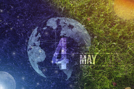May 4th. Day 4 of month, Calendar date. Day to night background concept. Scene with globe the green grass with sun, stars, moon and calendar date. Spring month, day of the year concept.