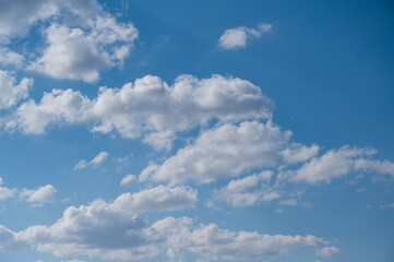 Cumulus clouds against the blue sky on a summer day.