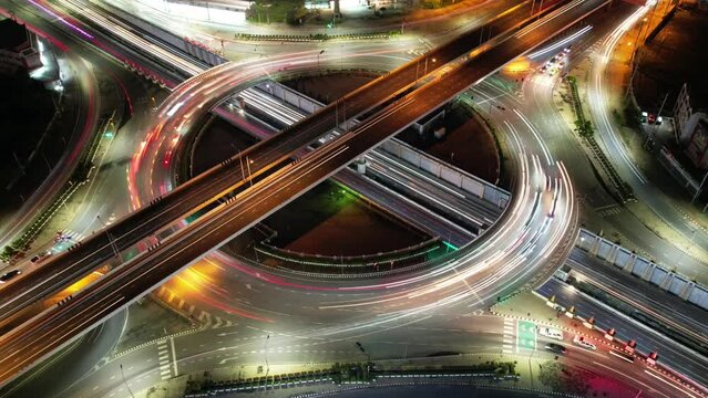 Expressway top view, Road traffic an important infrastructure, car traffic transportation above intersection road, aerial view cityscape of advanced innovation, financial technology	