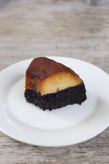 Impossible Cake slice served in a dish isolated on background top view of dessert