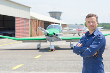 Portrait of man in front of aircraft