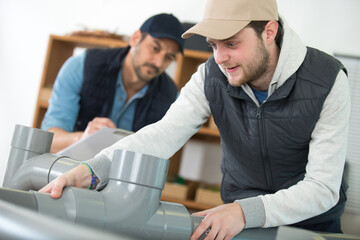 plumber assembling water fittings