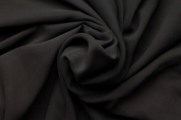 Fototapeta na wymiar Close-up abstract texture black color fabric cloth textile background, cotton wavy material, soft folds waves on the fabric. Macro, web theme, template, wallpaper, concept design, for your design