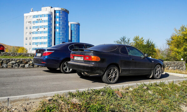 kazakhstan, Ust-Kamenogorsk, october 4, 2022: Toyota Celica GT-Four ST185 (1989—1993) and BMW 5-Series (E60/E61; 2003–2010)