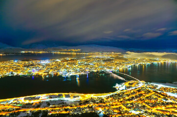 View of TView of Tromso, Norway at night in winter.romso, Norway at night in winter.