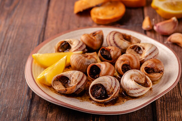 snails with butter on a plate