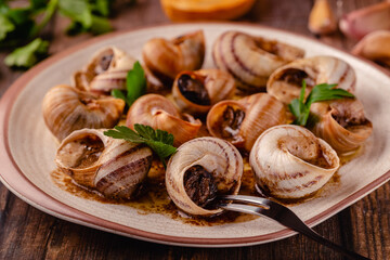 snails with butter on a plate