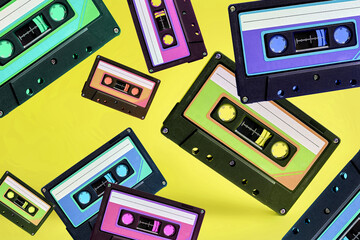Pop music style attributes eighties, retro old school concept. Multicolored audio cassette...
