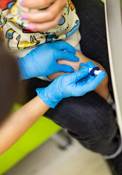Nurse hands taking small cute boy vaccination. Little child first vaccination.