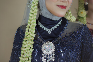 beautiful model, wearing hijab, Javanese Indonesian wedding dress in an indoor photography studio,...