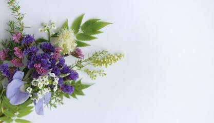 Spring bouquet with lilac and white flowers on a white background. Delicate floral arrangement. Background for a greeting card.