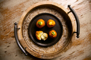 Tapa of cod fritters. Bechamel balls with fried cod.