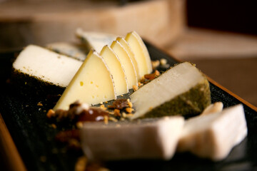 Assorted cheese platter. Traditional spanish tapa with manchego cheese, gorgonzola, goat cheese, cured cheese.