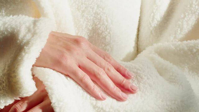 Middle aged woman wearing bathrobe and white towel touching robe in hotel. Skin care spa wellness salon procedures. 