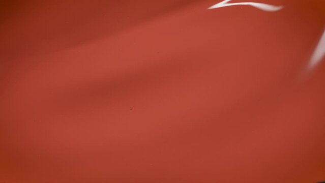 Orange gel nail polish, brush stroke. Macro