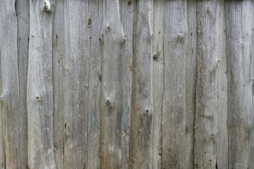 texture. Wooden boards. Wooden fence made of gray unpainted boards.