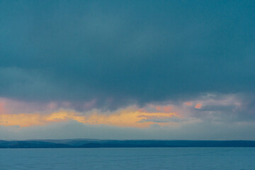 Sea and sky horizon with storm clouds