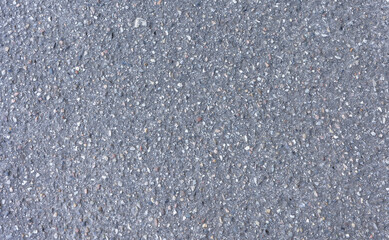 textured of gray rough asphalt with white and black rock, dark grey tarmac roadway surface seamless, top view closeup