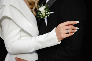 groom with wedding bouquet