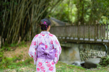 Asian woman with Japanese yukata in countryside