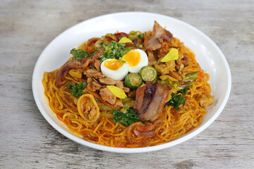 Panciit Hacienda pasta noodles served in a dish isolated on grey background side view