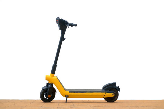 Yellow electric scooter on pavement isolated on white background