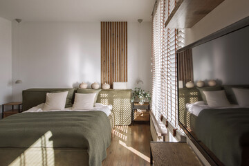 Modern Japandi bedroom interior design in earth tones, natural textures with wooden solid oak furniture. Japandi concept