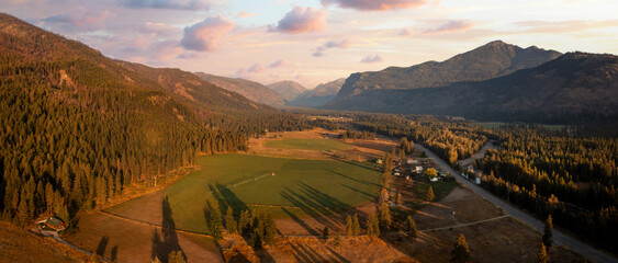 Aerial Panoramic View of the Historic Methow Valley in Eastern Washington State. Farm and ranch land lead to the North Cascade Mountains in this stunning landscape photographed on an autumnal morning.