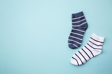 Odd socks day concept. Mismatch socks at color background. Top view.