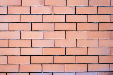 Obraz premium A fragment of a red brick wall