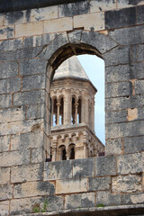 Fototapeta na wymiar Saint Domnius tower seen through The Silver Gate. Historical landmarks in Split, Croatia. Selective focus.
