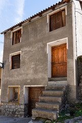a traditional wooden door at the entrance to a Spanish stone dwelling, Pyrenees mountains, Spain