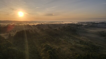 Obraz premium Sunrise near City with fog