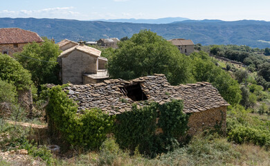 Fototapeta na wymiar an old Spanish farm cottage with stone walls and stone roof tiles