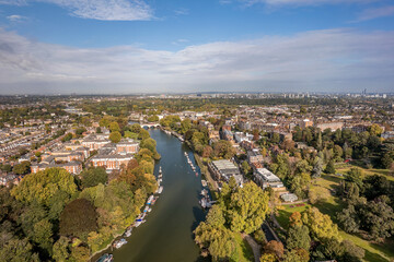 The aerial view of Thames river runs through Richmond town centre on the east bank with its neighbouring district of East Twickenham to the west, London.