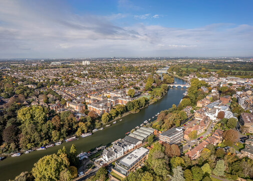 The aerial view of Thames river runs through Richmond town centre on the east bank with its neighbouring district of East Twickenham to the west, London.