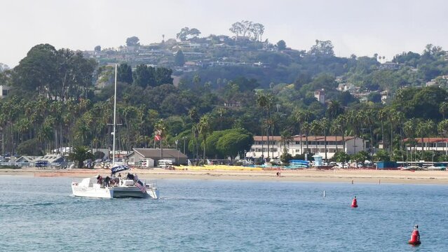 Catamaran sailing near the coast of Santa Barbara at the Stearns Wharf in California, USA